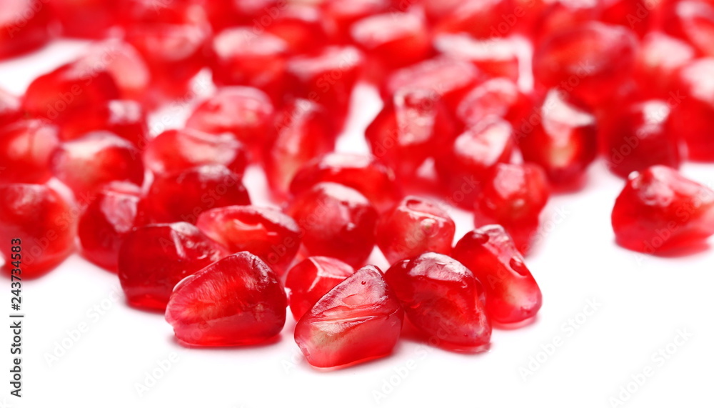 Pile pomegranate seeds macro isolated on white background Pile pomegranate seeds macro isolated on white background