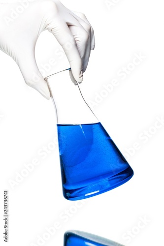 Hand Holding a Flask with Liquid