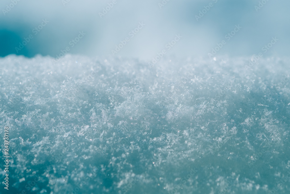 Blue winter snow snowflake shiny glow close up outdoor background