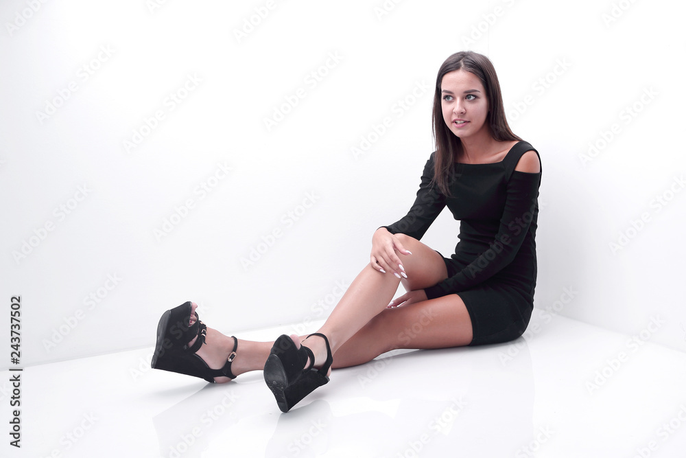 smiling young woman sitting on the floor smiling young woman sitting on the floor