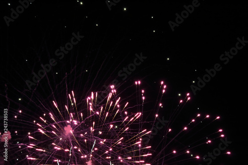 The sparkling and bright fireworks during the 2017 Pilar festival against a dark sky in Zaragoza, Aragon region, Spain