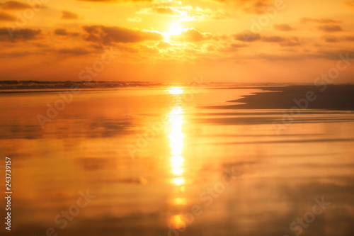 sandy beach at the sunset