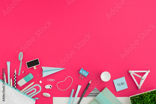 Creative flat lay desk in pink color. Back to school. photo