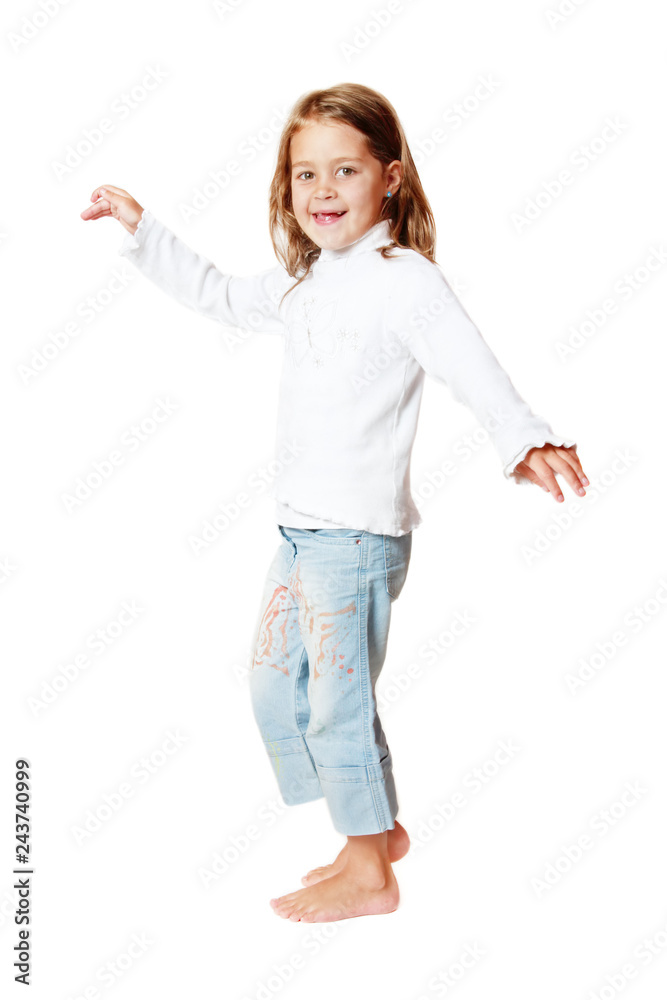Pretty smiling little girl dancing over white background Pretty smiling little girl dancing over white background