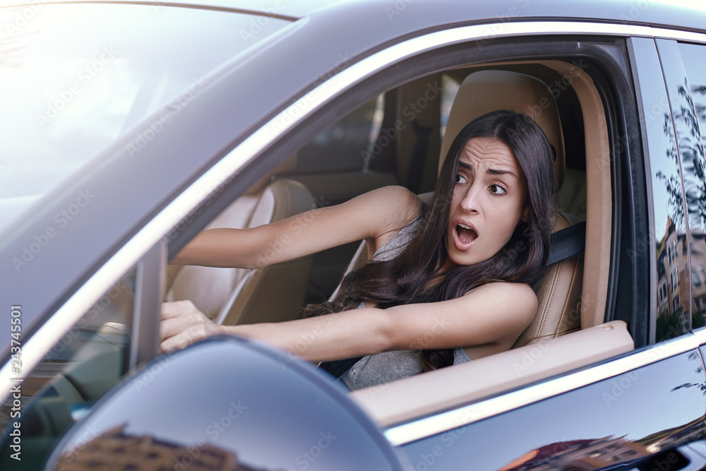 woman driving car in heavy traffic jam
