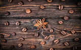 anise and coffee grains on a wooden background