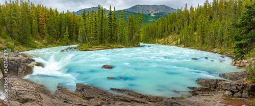 Sunwapta Falls with blue water flowing in Spring, Alberta, Canada