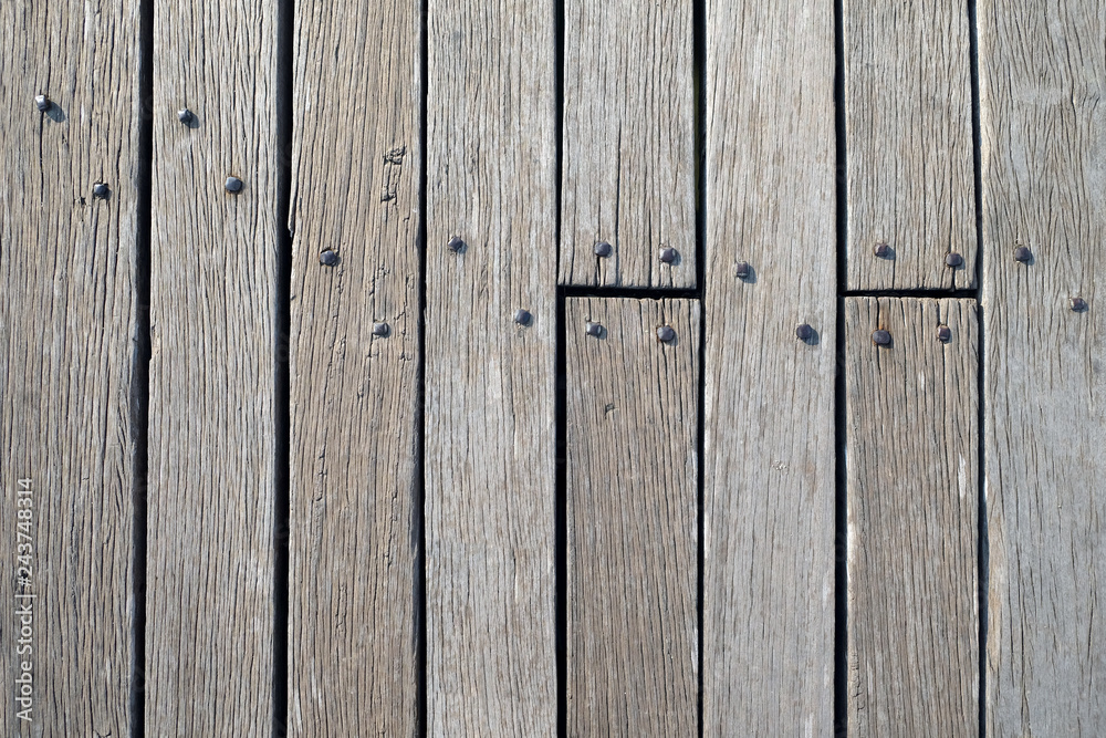 Fototapeta premium Surface from old vintage wooden boadrs fixed by metal nails front view close up
