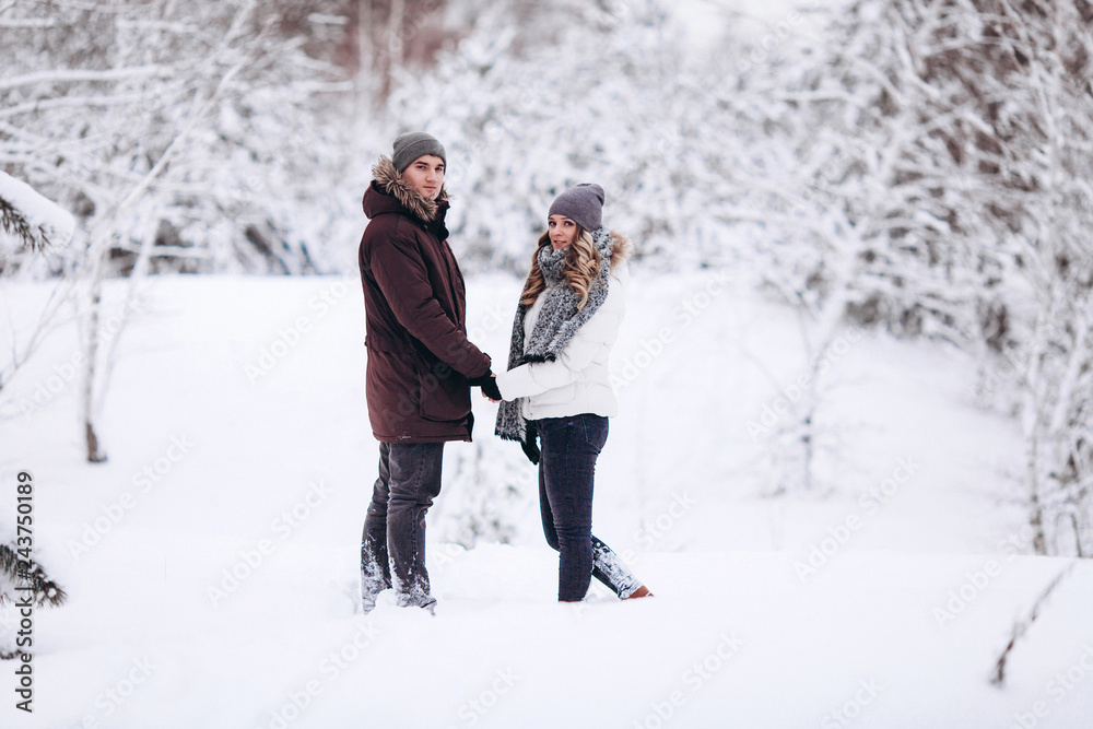 Young couple in love outdoor snowy winter Young couple in love outdoor snowy winter