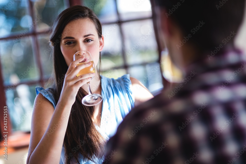 Couple drinking white wine in restaurant