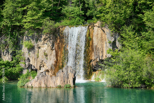 The beautiful view of waterfalls in Plitvice lakes . The water is clear and turquoise.