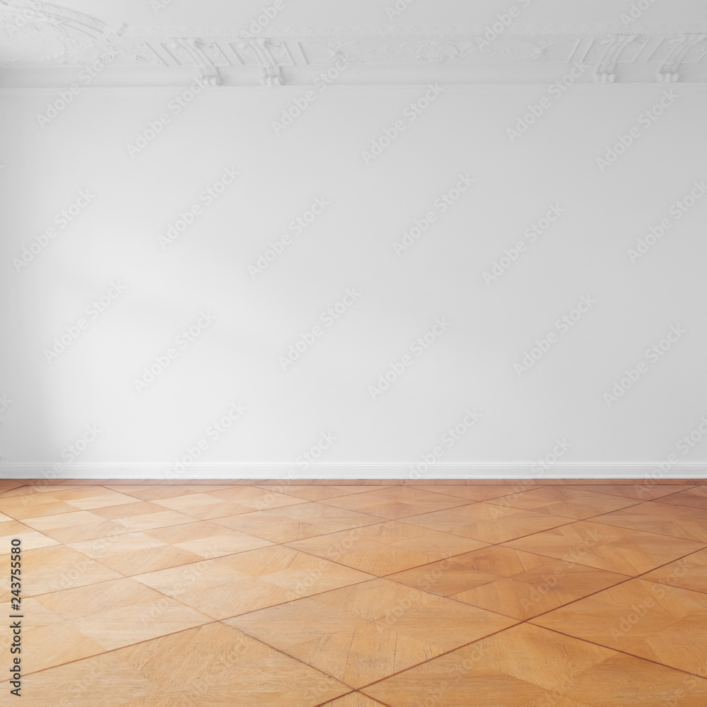 empty room with parquet floor newly renovated old building with white wall copy space background