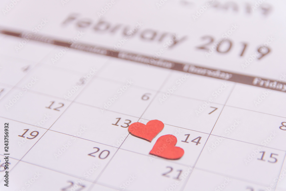 Valentines day greeting card. Red hearts paper on Calendar page February 14 with copy space Valentines day greeting card. Red hearts paper on Calendar page February 14 with copy space