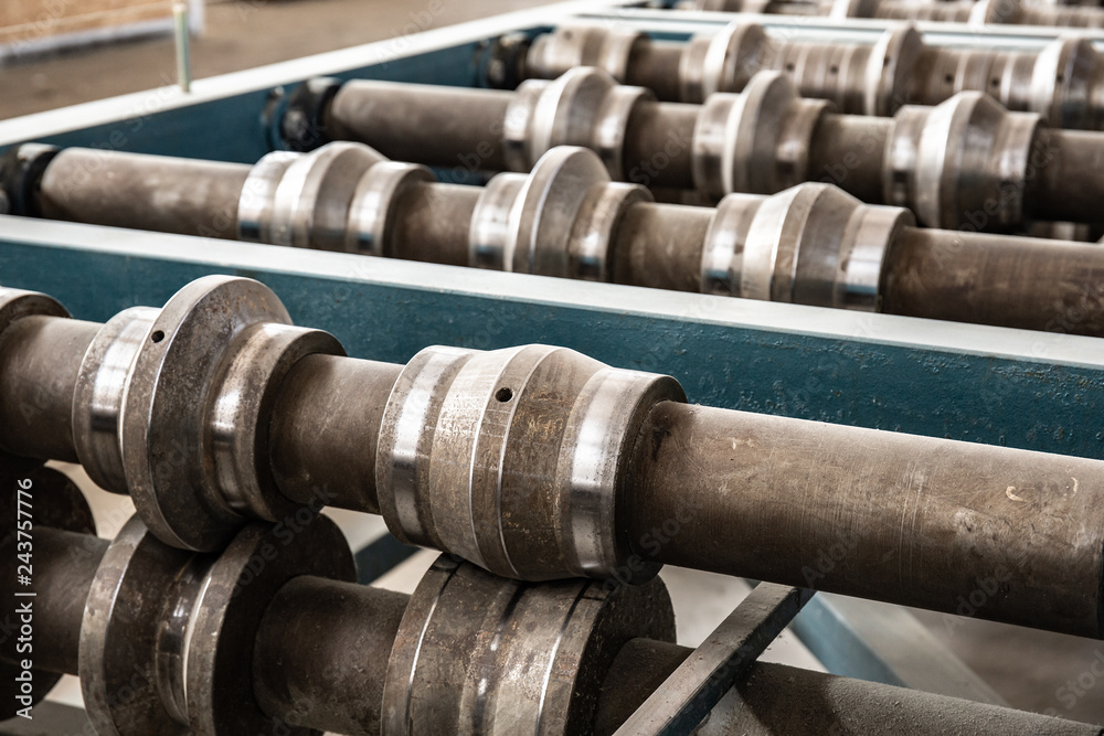 Conveyor belt or line close up in sandwich panel manufacturing production factory, industrial steel machine equipment Conveyor belt or line close up in sandwich panel manufacturing production factory, industrial steel machine equipment