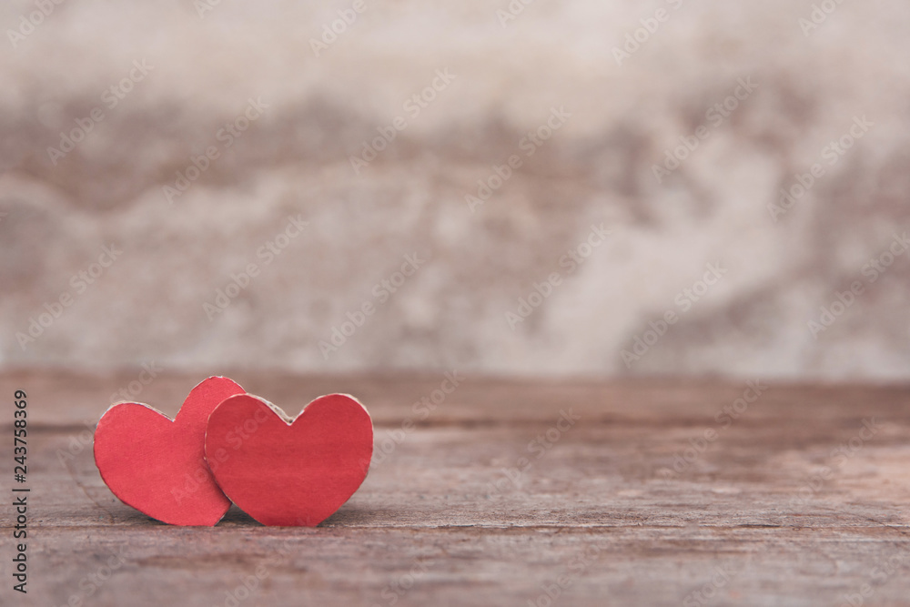 Valentines Day background with red heart shape on dark wooden background with copy space Valentines Day background with red heart shape on dark wooden background with copy space
