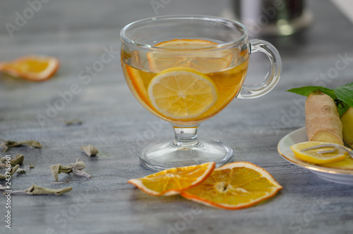 A cup of herbal tea with lemon