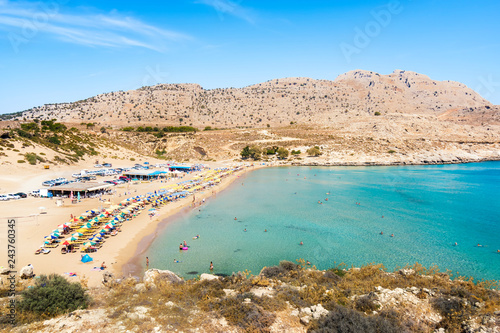 Agathi beach with holiday makers enjoying their time (Rhodes, Greece) photo