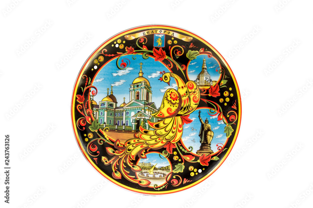 ceramic souvenir toy in the form of plate with color painting on isolated white background reflecting the national Russian culture with the inscription in Russian: the name of the city of Belgorod