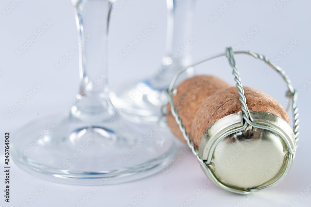 Champagne cork and metal basket on the table. Special closure from sparkling wine. Champagne cork and metal basket on the table. Special closure from sparkling wine.