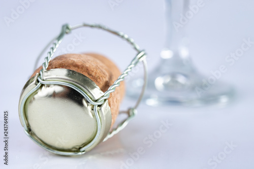 Champagne cork and metal basket on the table. Special closure from sparkling wine.