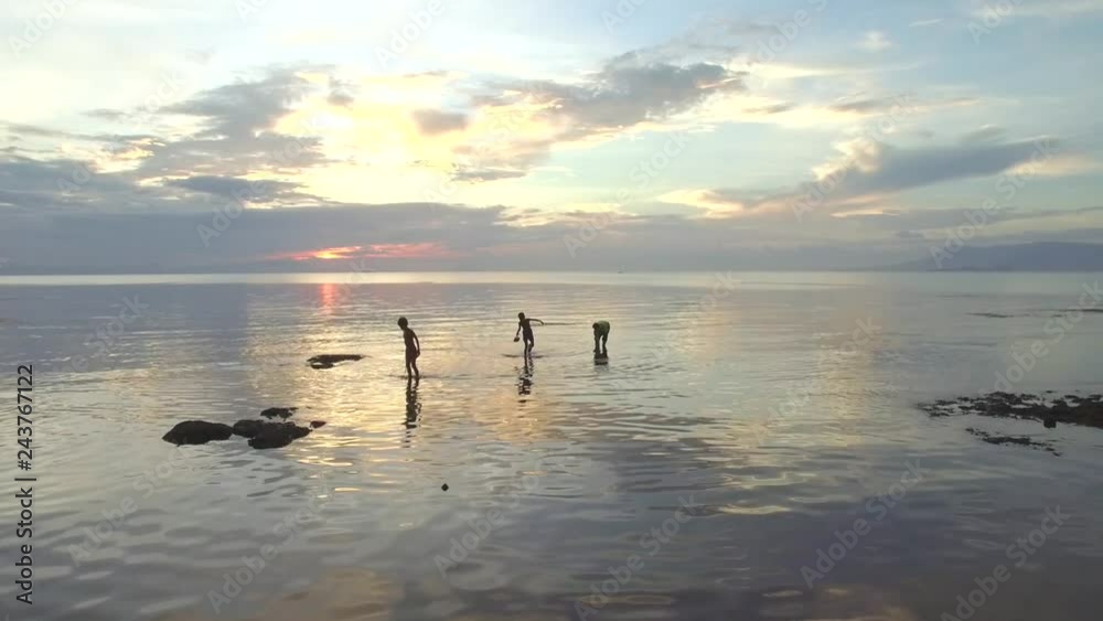 Aerial view of two persons walking on shore water, Kep, Cambodia. Aerial view of two persons walking on shore water, Kep, Cambodia.