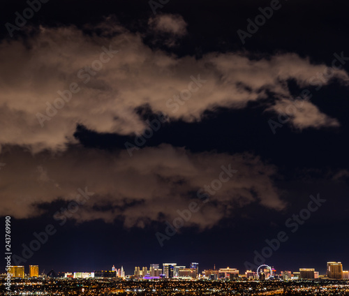 Las Vegas Skyline at night with dark sky and illuminated clouds © C.A.Palmira Photos