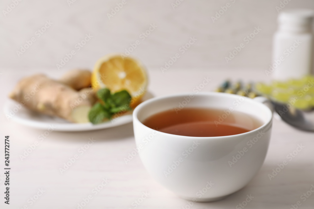 Cup of hot tea on table, space for text. Cough remedy Cup of hot tea on table, space for text. Cough remedy