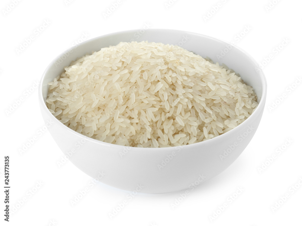 Bowl with uncooked parboiled rice on white background