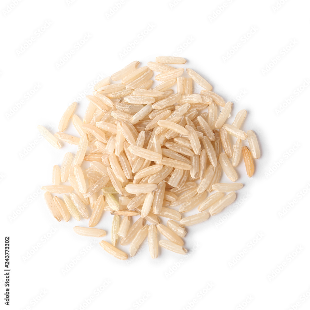 Uncooked brown rice on white background, top view Uncooked brown rice on white background, top view