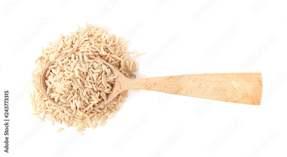 Spoon and uncooked brown rice on white background, top view - obrazy, fototapety, plakaty 
