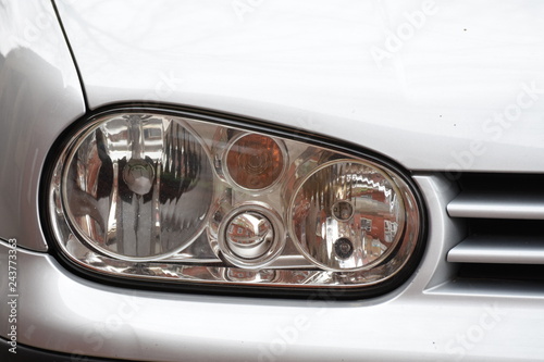 shiny headlights on a silver car