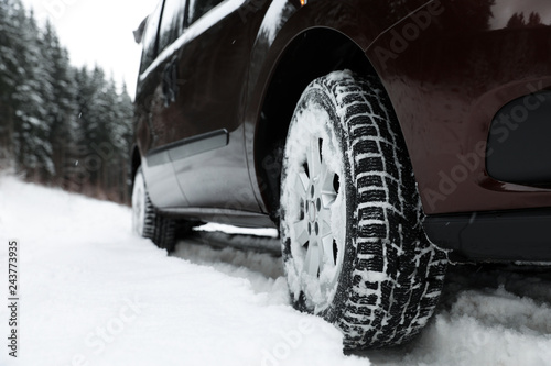 Closeup view of car in snow near road. Space for text © New Africa