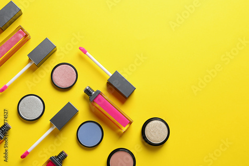 Composition with lipsticks on color background, flat lay. Space for text