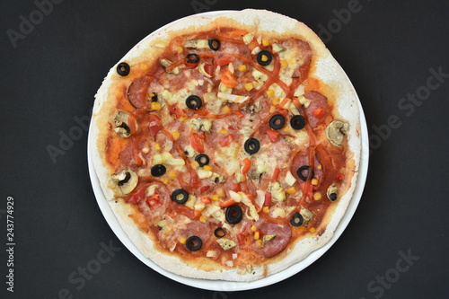 pizza with olives and cheese on black