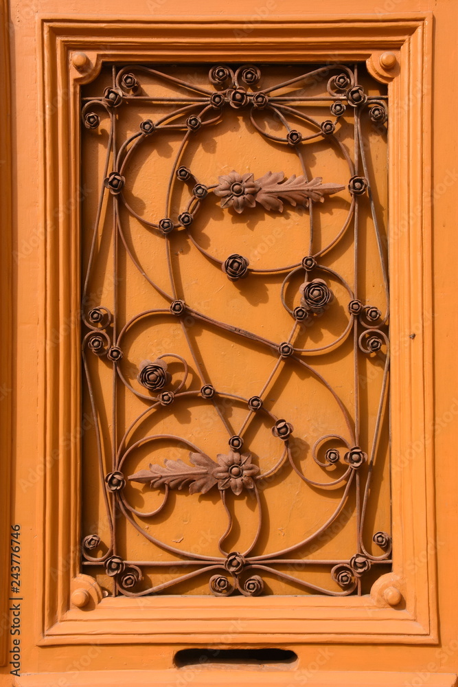 Architectural artistic decorations with wrought iron on old wooden door, in Bistrita Architectural artistic decorations with wrought iron on old wooden door, in Bistrita