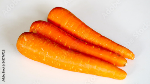 Fresh carrot isolated on white background. photo