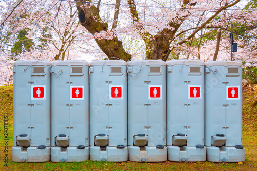 Public toilets prepared for tourist during the full bloom cherry blossom period in Hirosaki Park in Japan photo