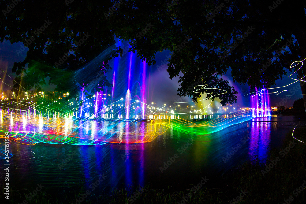 Water laser show, beautiful streams of water in the evening
