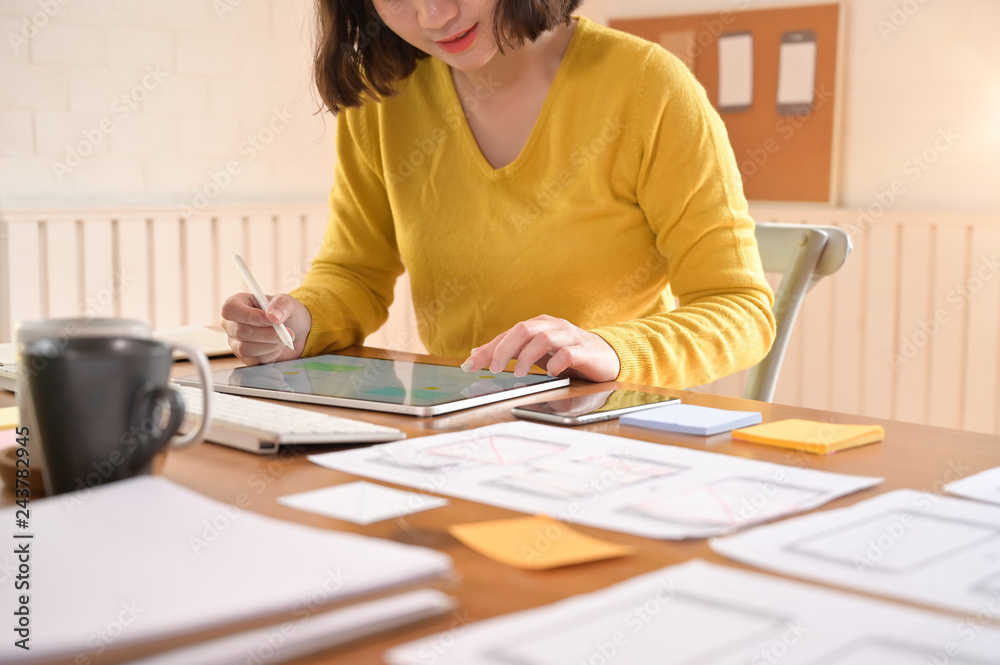 A female programer working with digital tablet a software developer job. A female programer working with digital tablet a software developer job.