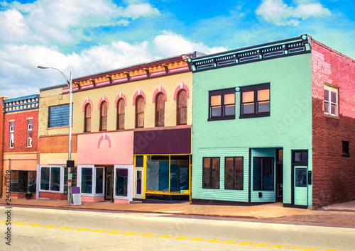 Vibrant pastel-colored main street usa storefronts, concept photo