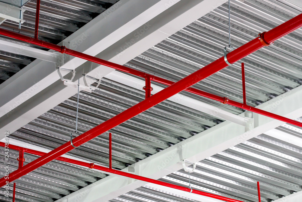 Sprinkler pipe installation under roof with hanger Stock-Foto | Adobe Stock