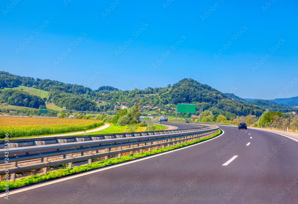 landscape with highways and driving cars