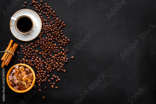 coffee bean and cup of americano on black table background top view mockup