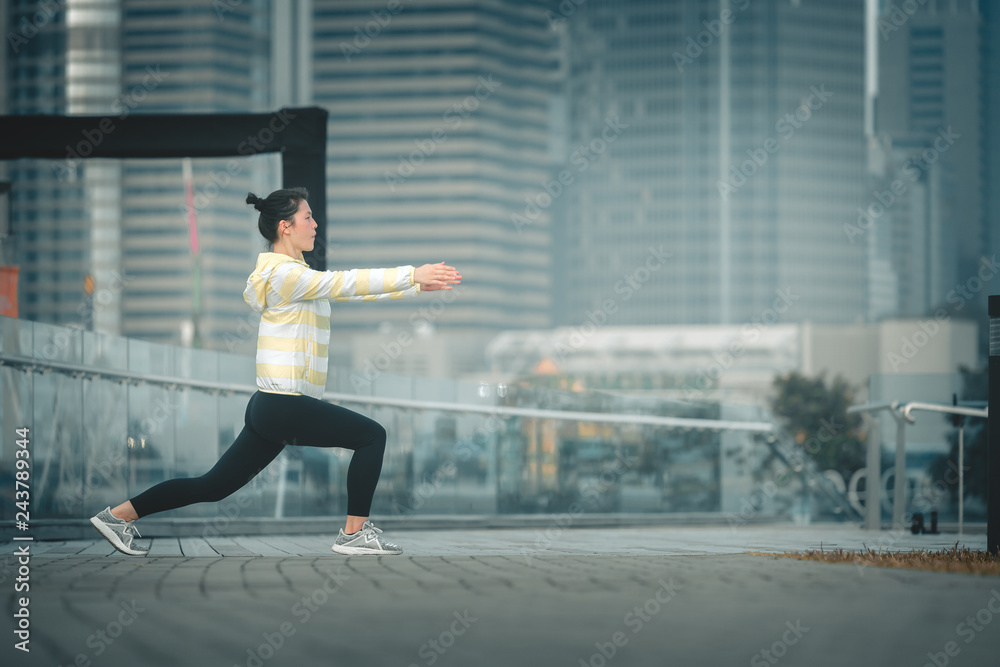 Young asian woman doing excusice in the city Young asian woman doing excusice in the city