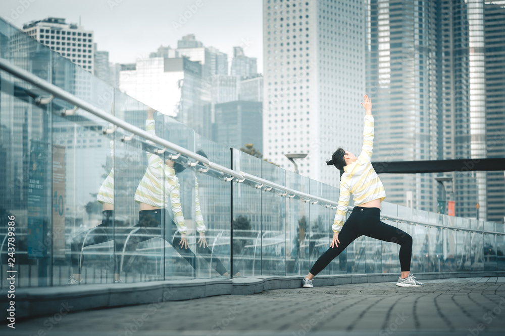 Young asian woman doing excusice in the city Young asian woman doing excusice in the city
