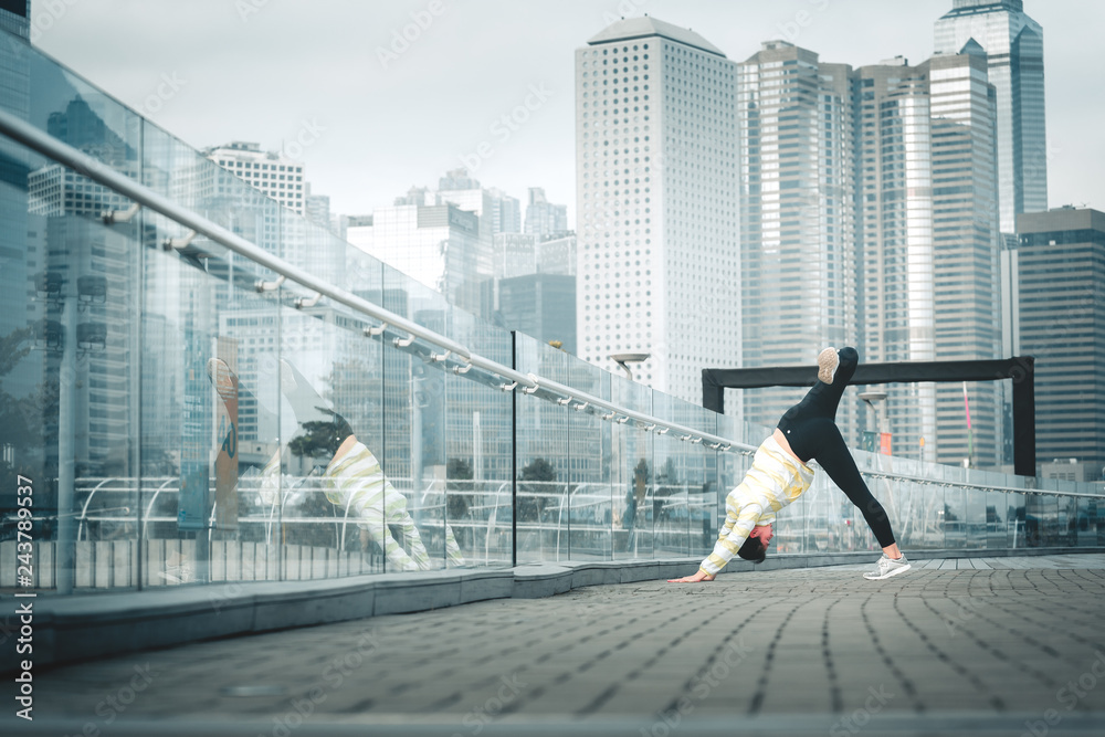 Young asian woman doing excusice in the city Young asian woman doing excusice in the city