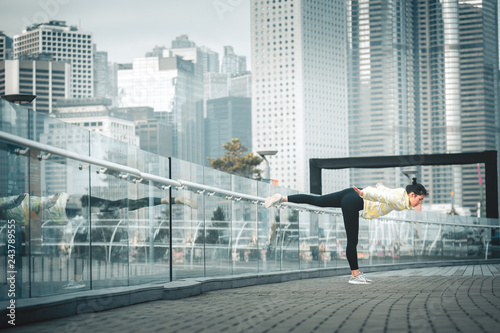 Young asian woman doing excusice in the city