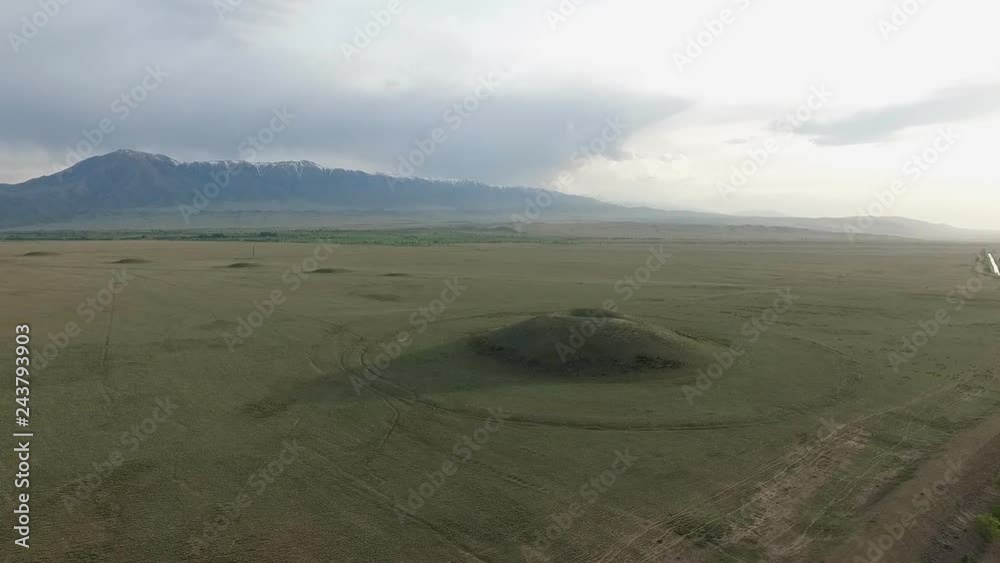 Grave mound in the steppe. Video from the air. Kazakhstan. Monument of history.