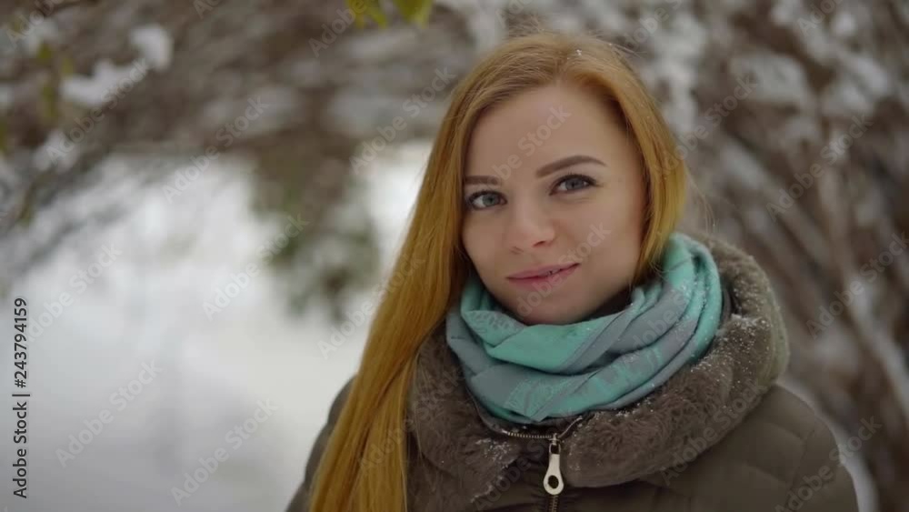 portrait of a beautiful long-haired girl on the background of a winter Park portrait of a beautiful long-haired girl on the background of a winter Park