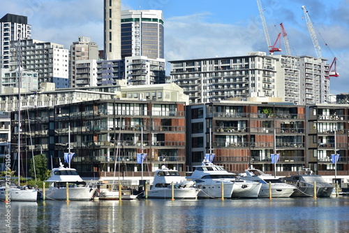 Apartment buildings built right next to boat berths of Viaduct Harbour in Auckland downtown.